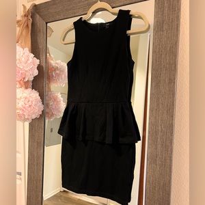 Black dress with peplum skirt